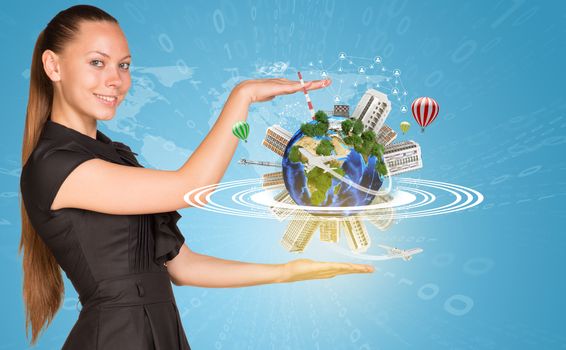 Beautiful businesswoman smiling and looking at camera. Beside is miniature Earth with trees, industrial and residential buildings, air balloons, airplane and surrounded by rings. Network with people icons, contoured world map and figures as backdrop. Elements of this image furnished by NASA