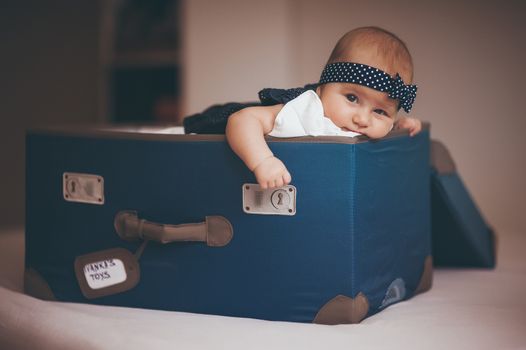 sweet baby girl with bow in box