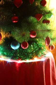 Christmas tree decorated with red and blue toy with a star on top