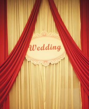 Chinese traditional red wedding banqueting hall curtains with wedding sign in English language. 