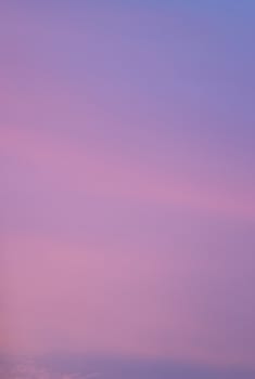 Sky with clouds in blue and pink sunset evening pastel colors rectangular photo. 
