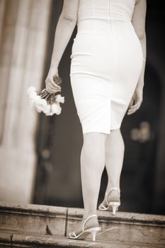 Black and white photo of wedding marriage bouquet in hands of bride.
