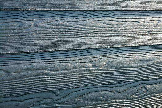 Details of classical black wood panels siding                               