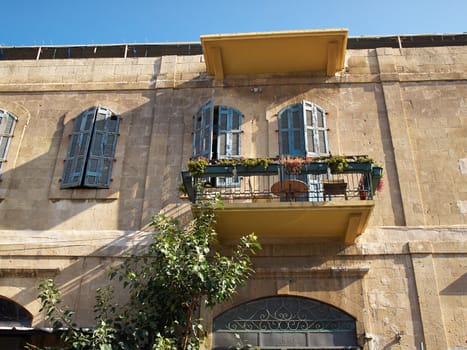 Romantic Mediterranean European style classical balcony in an old stone building