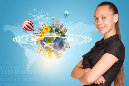 Beautiful businesswoman smiling and looking at camera. Beside is miniature Earth with trees, flowers, industrial and residential buildings, air balloons, airplane and surrounded by rings. Network with people icons and contoured world map as backdrop. Elements of this image furnished by NASA