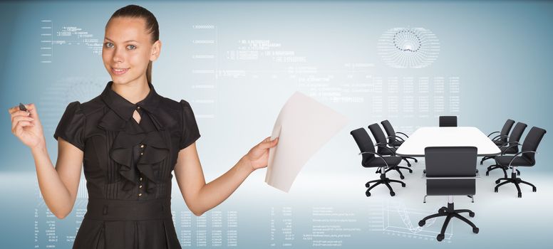 Beautiful businesswoman holding blank paper sheet and felt pen ready to use.  Beside is big conference table with chairs. Hi-tech graphs as backdrop