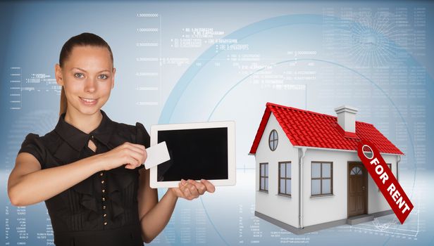 Beautiful businesswoman holding blank tablet PC and blank business card in front of PC screen. Beside is model house with tag for rent. Hi-tech graphs with various data as backdrop
