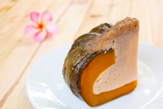 slice of Egg Custard in the pumpkin, thai dessert.
