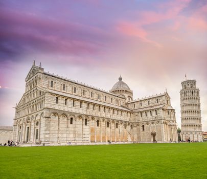 Pisa, Cathedral and Leaning Tower in Square of Miracles at sunset.