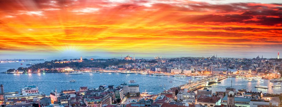 Wonderful panoramic view of Istanbul at dusk across Golden Horn river.