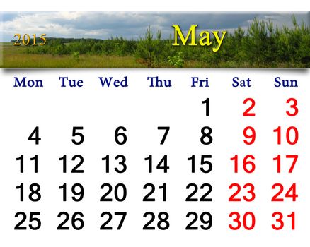 calendar for May of 2015 on the background of thunder storm clouds and pines