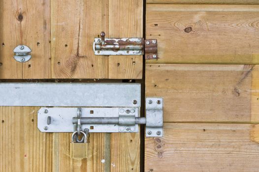 Metal bolts on a wooden door