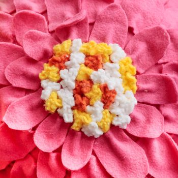 Part of a pink home made flowery fleece cushion