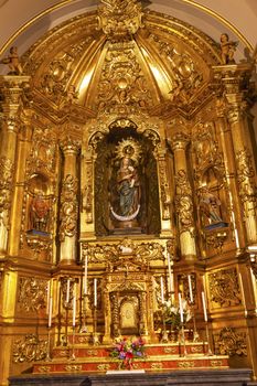 Basilica Golden Altar Mary Jesus Statue Santa Iglesia Collegiata de San Isidro Madrid Spain. Named after Patron Saint of Madrid, Saint Isidore, Church was created in 1651