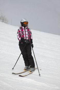 Female skier coming down the slope