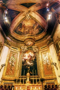 Basilica Dome Altar Candles Saint Michael's Basilica Pontifica de San Miguel Madrid Spain.  Pontifical Basilica of St. Michael is a Baroque Catholic Church established in 1745.  Frescos by Bartolme Rusco in 1745. Vatican Church in Spain