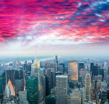 Stunning sunset over Midtown Manhattan, aerial view of New York City.