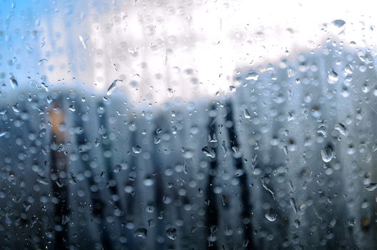 Closeup of natural water drop on glass background