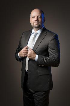 image of a serious business man with dark background