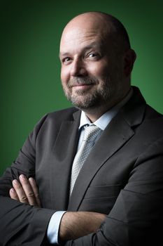 image of a friendly business man with green background