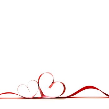 Red heart ribbon bow isolated on white background