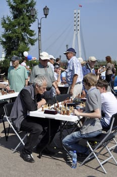 Chess tournament on the street in the summer