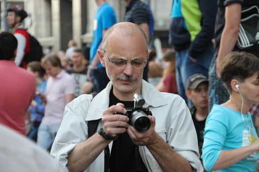 Moscow, Russia - July 18, 2013. Journalist Dmitry Borko at the rally in support of Navalny. Thousands of Muscovites went on this day in support of arrested opposition leader Alexei Navalny