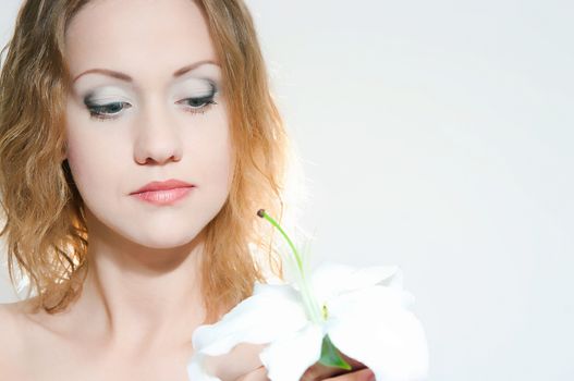 portrait of the girl with a lily flower