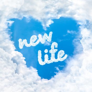 new life word inside love cloud heart shape blue sky background only