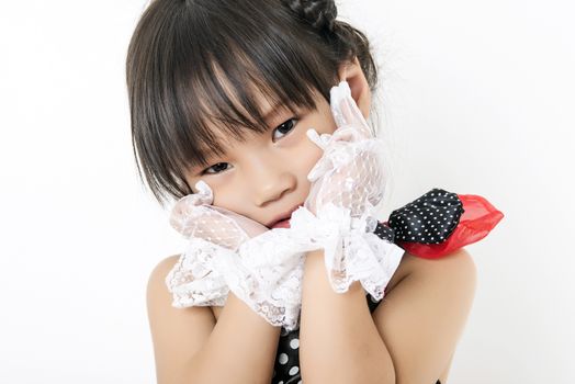 child girl in red suit on white background