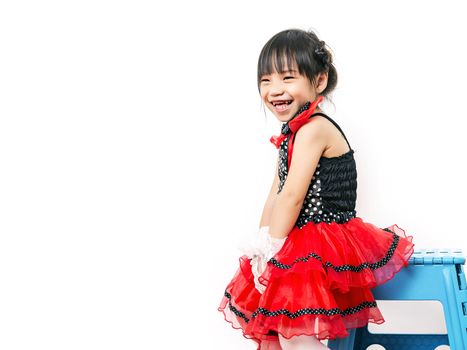 child girl in red suit on white background