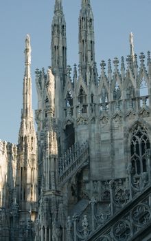 Silhouettes of statues on the roof of the Duomo in Milan