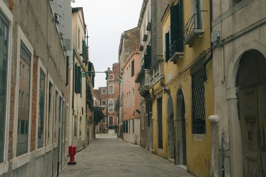 Venetian street in winter cloudy day