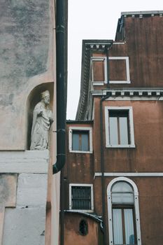 Sculpture of a saint on Venetian street
