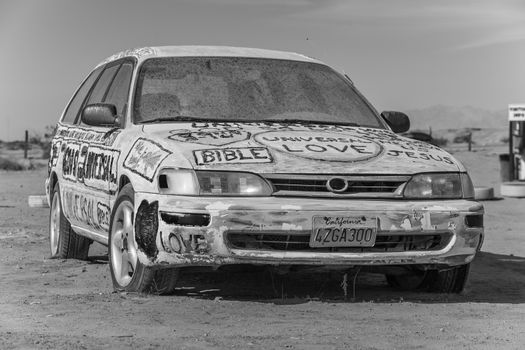 CALIPATRIA, IMPERIAL COUNTY, CALIFORNIA, USA - NOVEMBER 28: Bible car outsider art installation at Salvation Mountain on November 28, 2014 in at Calipatria, California, USA.