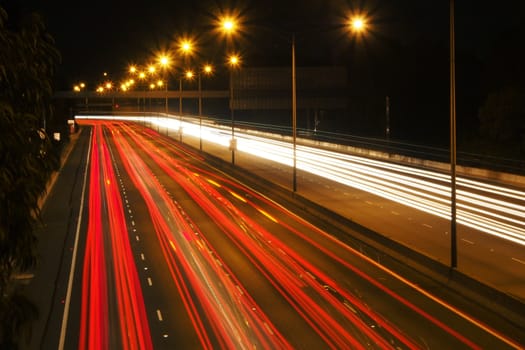 Light trails on a freeway or motorway at night.