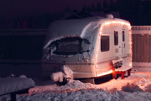 Winter camping holiday decorated garland. white Caravan