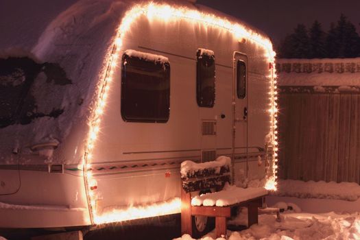 Winter camping holiday decorated garland. white Caravan