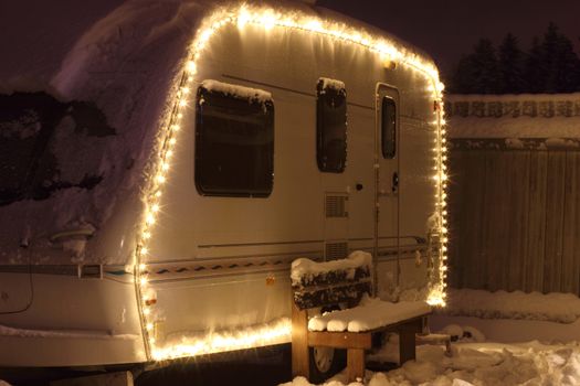 Winter camping holiday decorated garland. white Caravan