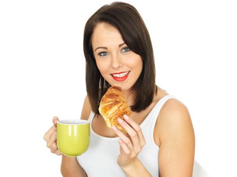 Attractive Young Woman Having Coffee and Croissant for Breakfast