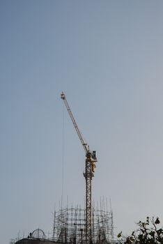 Crane for construction  a big buddha statue in Thailand.
