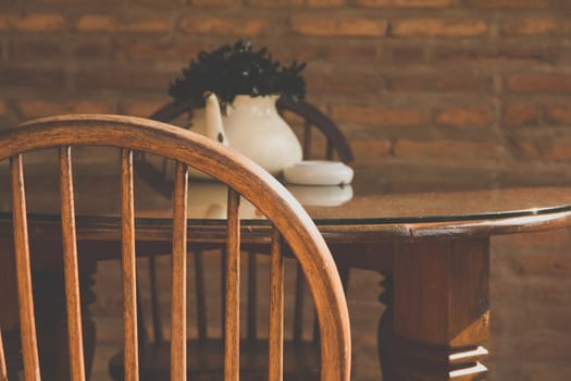 Image of vintage chair and table with flower