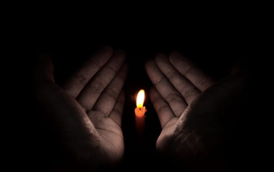 Candle light in hand, Hope and pray concept