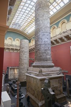 LONDON, UK - DECEMBER 20: The Cast Courts at the Victoria and Albert Museum. December 20, 2014 in London. The room includes a plaster copy of Trajan's column, divided in 2 sections due to its height.