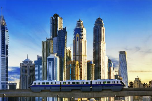 View of modern buildings with subway at sunset in Dubai Marina, Dubai