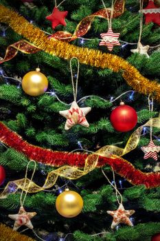 Decorated new year tree background with colored toys serpentine and garlands