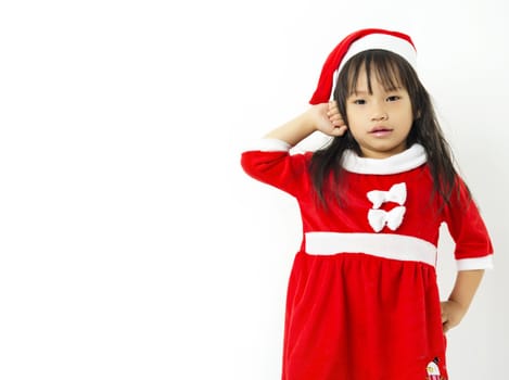 Asian little girl in red santa hat on white background