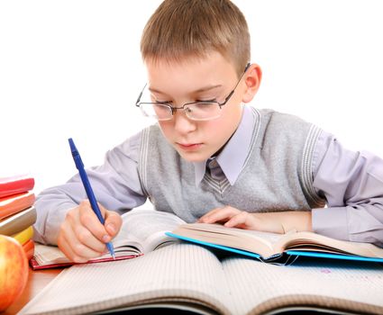 Kid write at the School Desk on the white background