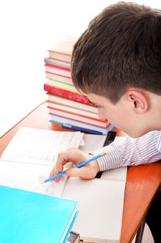 Student preparing for Exam at the School Desk