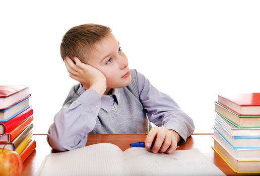 Bored Kid on the School Desk Isolated on the white background